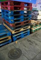 Shipping pallets ready for cargo blue and red and green photo