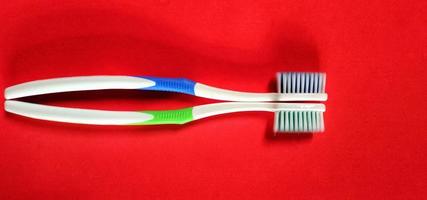 Toothbrush isolated on a red background photo