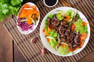 Salad with beef teriyaki photo