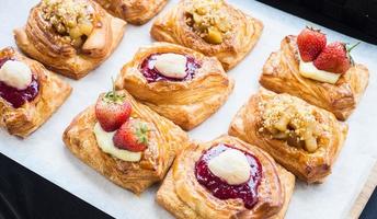 Variety of topping  on pasley, homemade bread, on white box photo