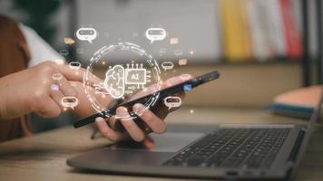 Businesswoman using chatbot in computer smart intelligence Ai. Chat GPT Chat with AI Artificial Intelligence, developed by OpenAI generate. Futuristic technology, robot in online system. photo
