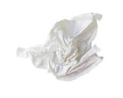 Single white screwed or crumpled tissue paper or napkin in strange shape after use in toilet or restroom isolated on white background with clipping path photo