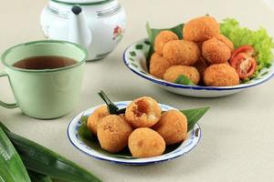 Combro and Misro, Cassava Cake Stuffed with Oncom or Palm Sugar. photo