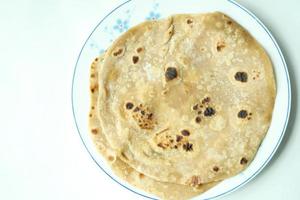 homemade roti chapati on table . photo