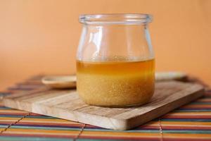 homemade ghee in container on a table , photo