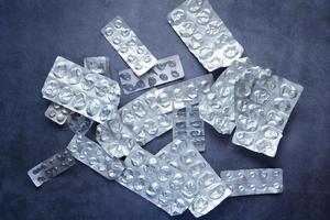 Close up of empty pills of blister pack on table photo