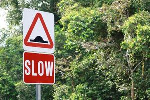 slow sign on street in Singapore photo