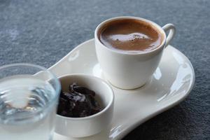a cup of turkish coffee on table outdoor photo
