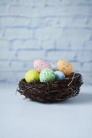 easter concept with multi color egg on pink background. photo
