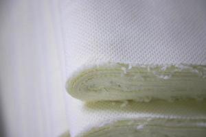 Close-up focus folded stacked sherpa fabric backdrop pattern textured  can be used as a background wallpaper photo