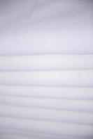 Close-up focus folded stacked sherpa fabric backdrop pattern textured  can be used as a background wallpaper photo