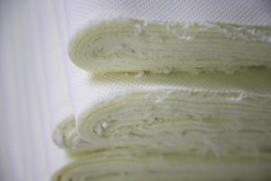 Close-up focus folded stacked sherpa fabric backdrop pattern textured  can be used as a background wallpaper photo