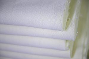 Close-up focus folded stacked sherpa fabric backdrop pattern textured  can be used as a background wallpaper photo