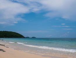 Beautiful Landscape viewpoint for design postcard and calendar  tropical rock beach front view sea blue sky overlooking Nang Ram Beach Sattahip Bay Chonburi Thailand On clear day white cloud holiday photo