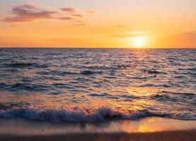 Front viewpoint landscape travel summer sea wind wave cool on holiday calm sea coastal area big sun set sky light orange golden Nature tropical Beautiful evening hours day At Bang san Beach Thailand. photo