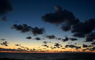 Sunset on cloudy sky backgound. Pathos, Cyprus photo