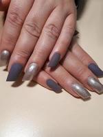 Acrylic nail extension, manicure, nail correction, hands in the foreground. Reflective design. photo