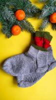 Knitted handmade items. Knitted fabric from colored thread. Bright background. photo