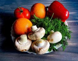 fruits and vegetables on a plate photo