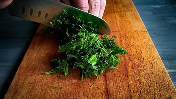 chopped parsley on a cutting board photo