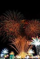 fireworks over the temple in the dark sky photo