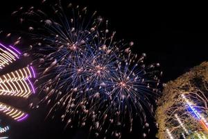 fireworks over the temple in the dark sky photo