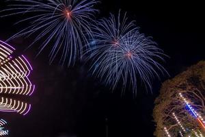 fireworks over the temple in the dark sky photo