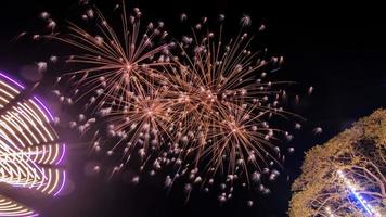 fireworks over the temple in the dark sky photo