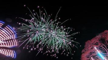 fireworks over the temple in the dark sky photo