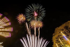 fireworks over the temple in the dark sky photo