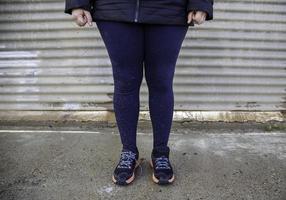 Woman's feet with mud photo