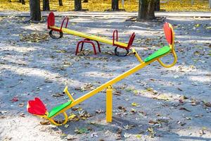 Photography on theme empty playground with metal swing for kids photo