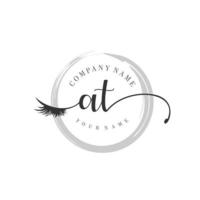 initial AT logo handwriting beauty salon fashion modern luxury monogram vector