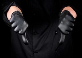 chef in black latex gloves shows gesture not like photo