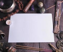 blank white sheet in the middle of religious objects for meditation photo