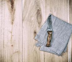 old kitchen knife on a gray napkin photo