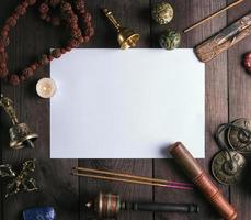 blank white sheet in the middle of religious objects for meditation photo