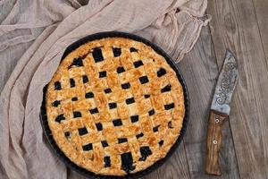 baked round black currant cake photo