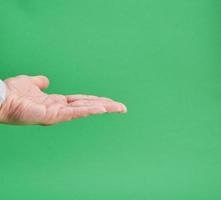 open female hand, gesture of holding the subject photo