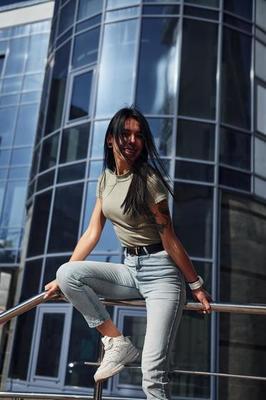 Positive woman with tattoo on arm have fun outdoors against business building at sunny daytime 19159596 Stock Photo at Vecteezy Positive woman with tattoo on arm have fun outdoors against business building at sunny daytime 19159596 Stock Photo at Vecteezy