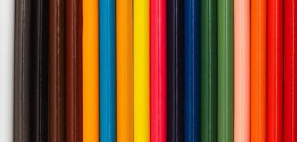 Multi color pencils. the concept of a multinational family and equality in the world. photo