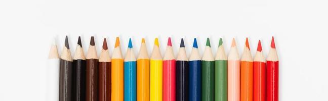 Multi color pencils. the concept of a multinational family and equality in the world. photo