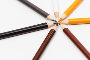 Multi color pencils. the concept of a multinational family and equality in the world. photo