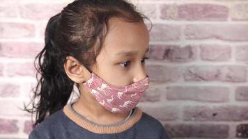 Young girl wearing face mask video