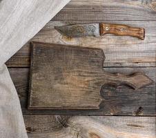 very old wooden kitchen board and vintage knife photo