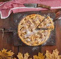 Baked whole round apple pie photo