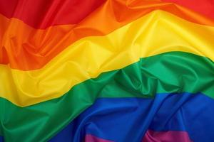 textile rainbow flag with waves, LGBT culture photo