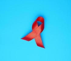 red ribbon-symbol of the fight against disease AIDS and vasculitis photo