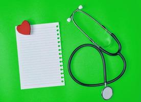 white piece of paper in a line and a medical stethoscope