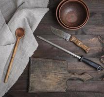 empty old brown wooden cutting board and knife photo